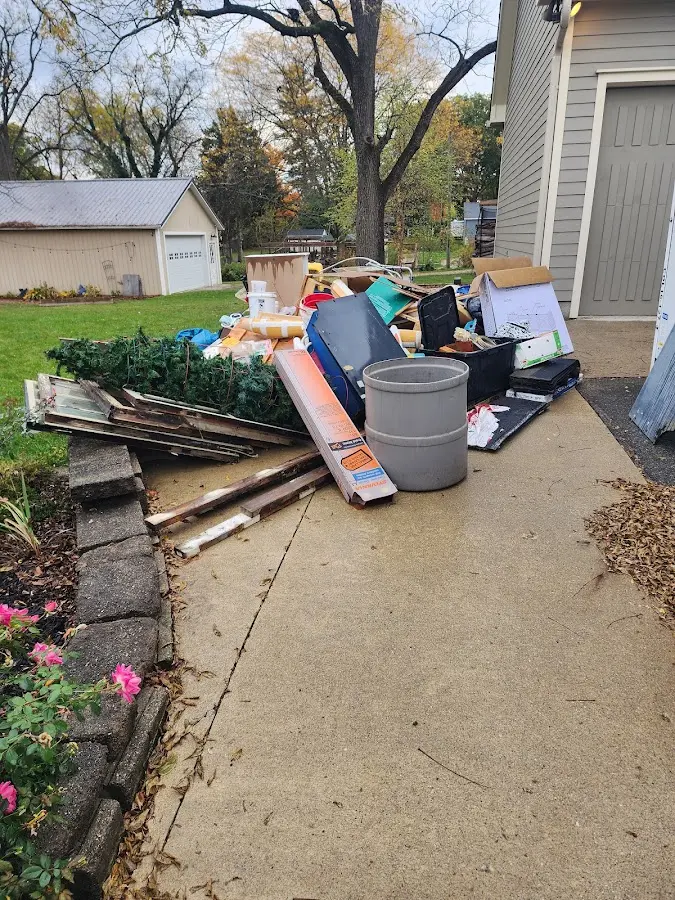 Dumpster being loaded with debris for Estate Cleanout Dumpster Rental in Luzerne